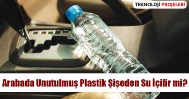 Araba koltuğunda unutulmuş plastik su şişesi, sıcak bir günde güneş ışığına maruz kalmış durumda